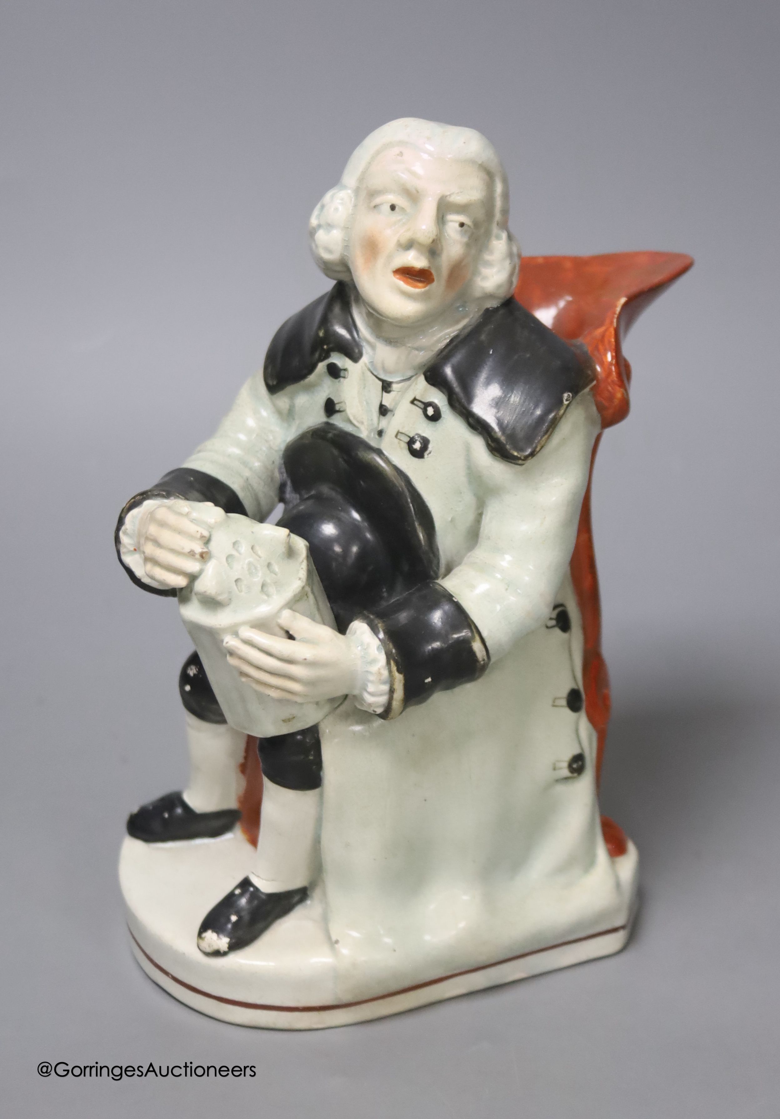 A Wood type pearlware seated Toby jug, height 20cm